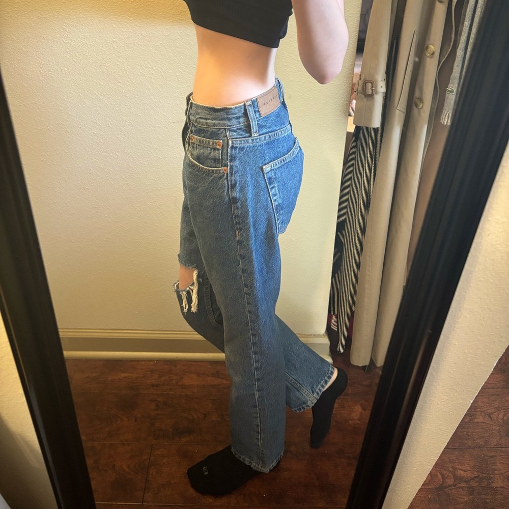 Topshop dark washed straight leg jeans with a stylish thigh rip